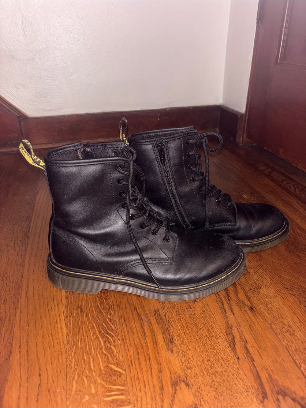Dr. Martens Black Leather Lace-Up Combat Boots with Yellow Heel Loop